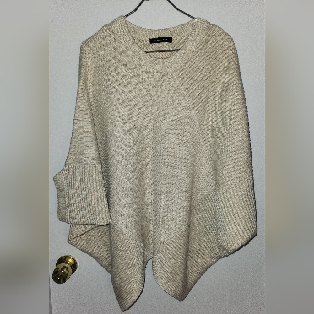 Poncho with sleeve